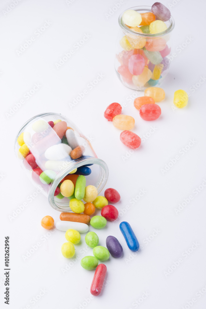 Multicolor candies in glass jars Multicolor candies in glass jars