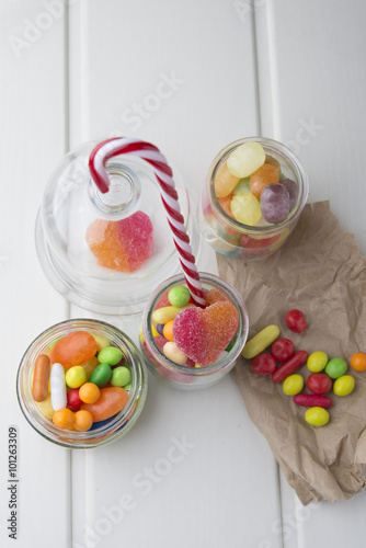 Multicolor candies in glass jars