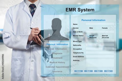 Doctor working with EMR - Electronic Medical Record system photo