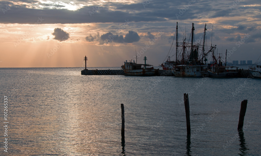 Sunrise View of Mexican Fishing Boat dock in Puerto Juarez in Mexico's Cancun Bay