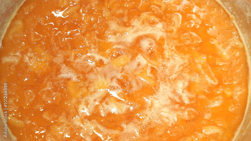 preparation of pumpkin jam on the hob in a saucepan preparation of pumpkin jam on the hob in a saucepan