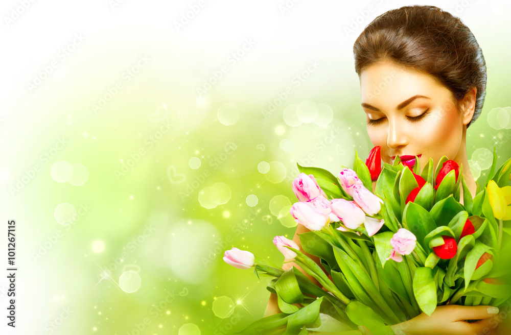 Beautiful girl with a bouquet of colorful tulip flowers Beautiful girl with a bouquet of colorful tulip flowers