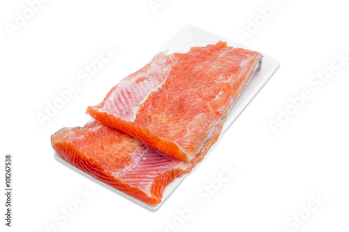 Uncooked fillet of rainbow trout on a rectangular dish