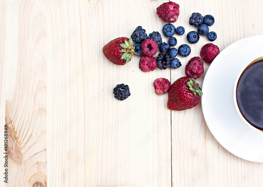 Summer berries (strawberries, raspberries, blueberries, blackberries) and a cup of coffee Summer berries (strawberries, raspberries, blueberries, blackberries) and a cup of coffee