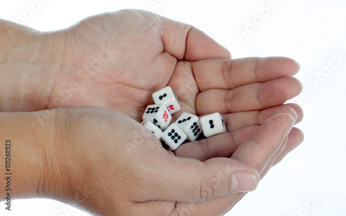Throwing white gambling dices on white background ,selective focus