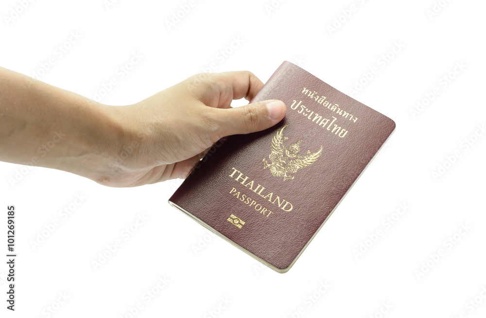 hand holding passport book hand holding passport book