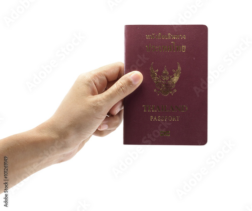 hand holding passport book