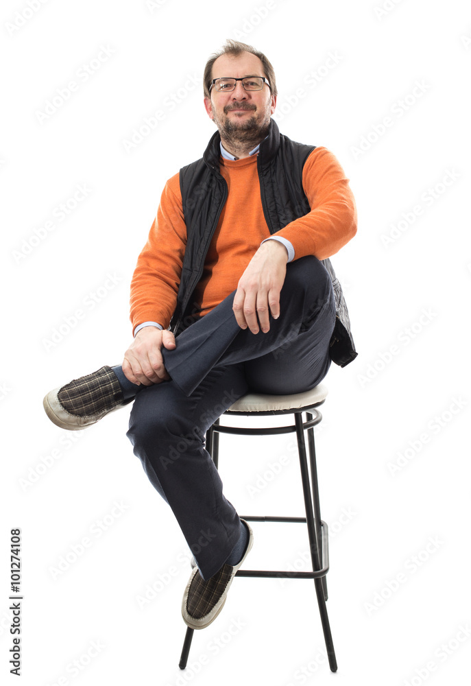 Confident male model with crossed legs. Confident male model with crossed legs.