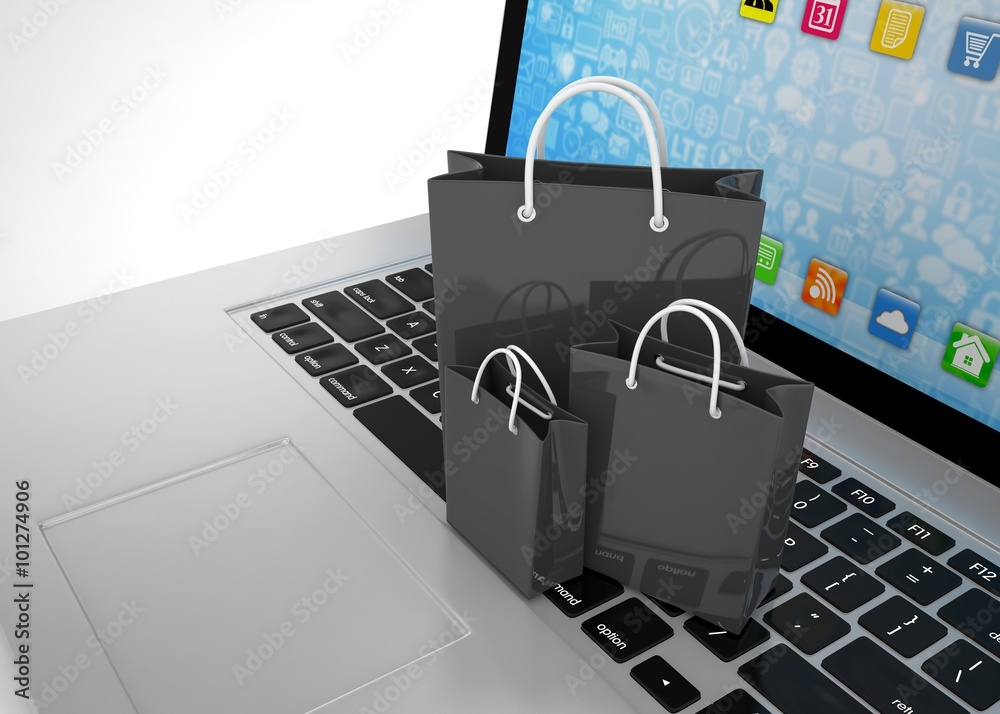 laptop and shopping pags on white background laptop and shopping pags on white background