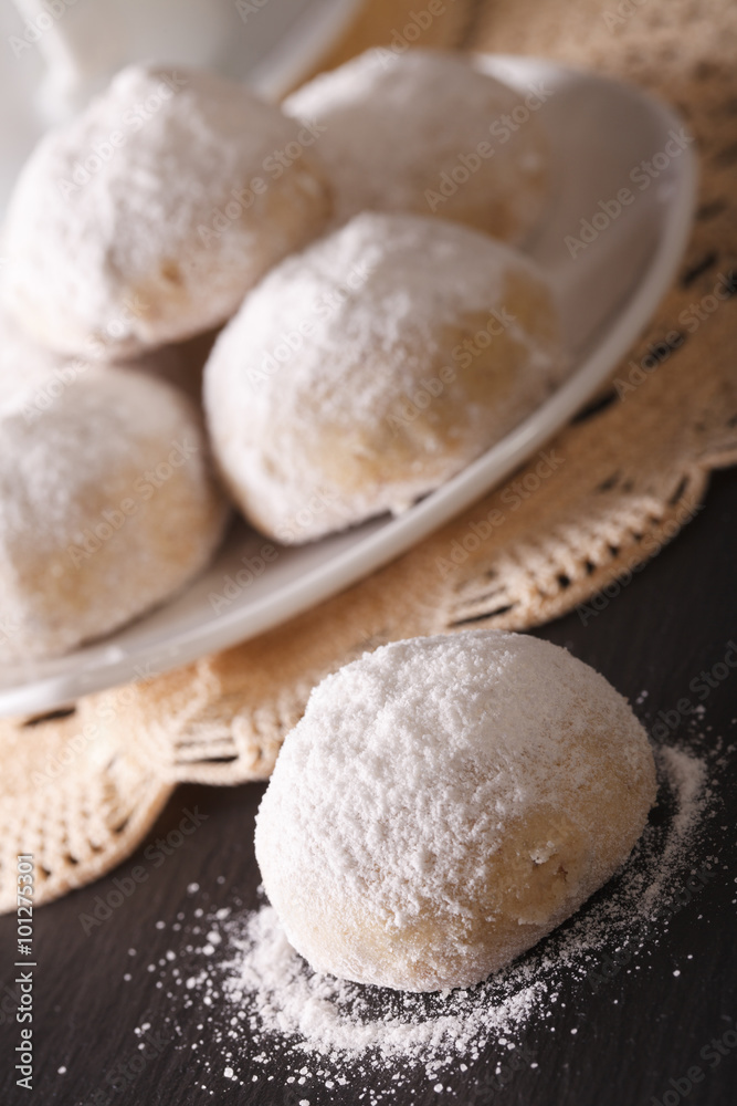 polvorón cookies with pecans and powdered sugar macro. vertical
