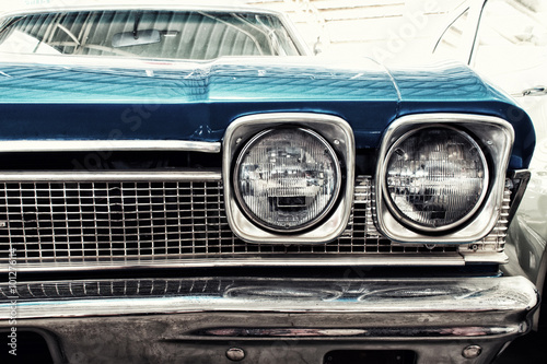 Close Up of Front of a Blue Vintage Car