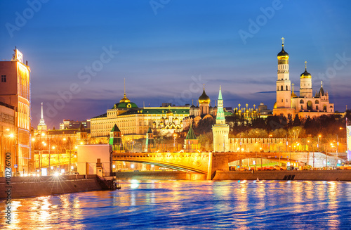Moscow Kremlin glowing in the evening light over Moskva River  Russia