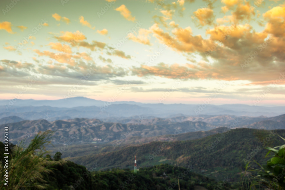 Blur landscape sunrise view on peak of mountain background Blur landscape sunrise view on peak of mountain background