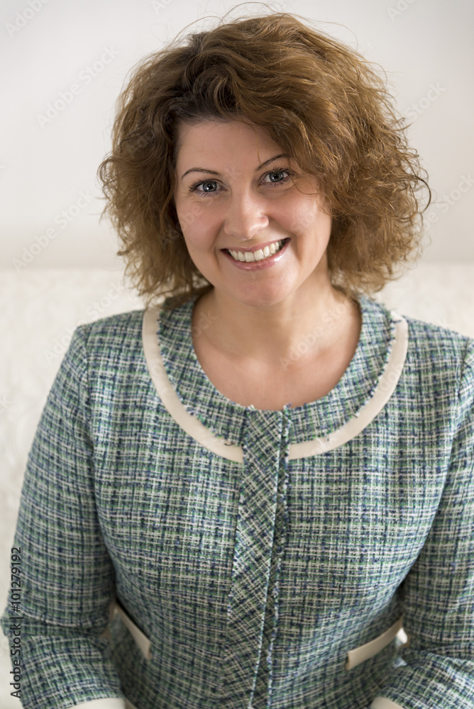 Portrait of middle-aged woman with curly hair Portrait of middle-aged woman with curly hair