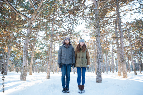 Beautiful happy couple standing in winter park © Drobot Dean