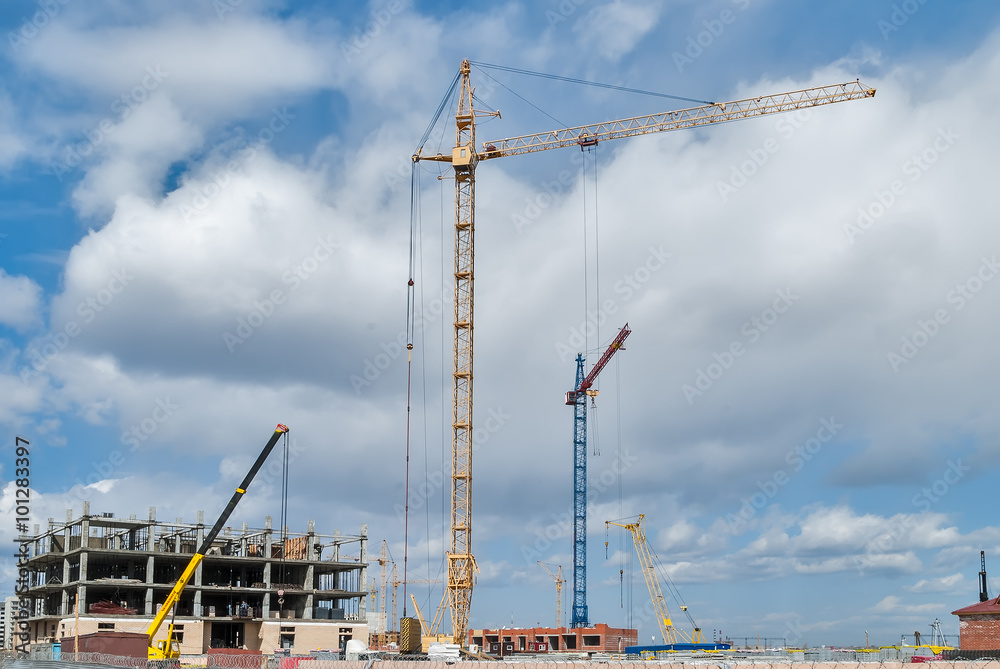 Construction site with crane and building in Tyumen. Russia Construction site with crane and building in Tyumen. Russia