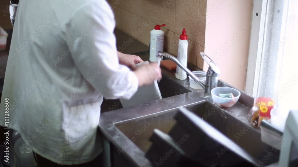The kitchen staff washes the dishes in the sink
The kitchen staff washes the dishes in the sink