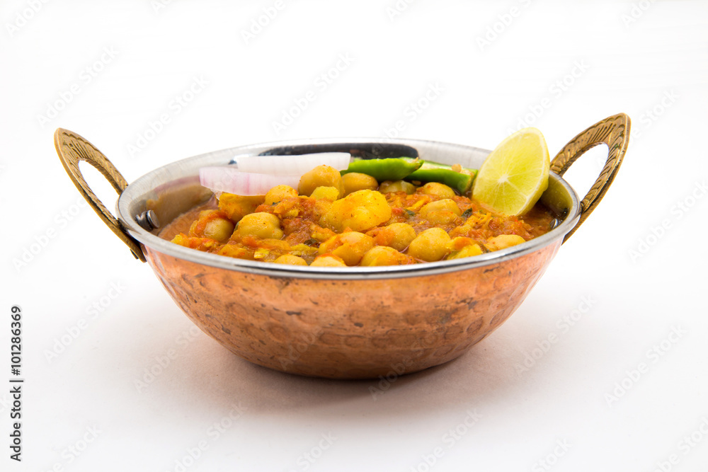 Chana Masala - An Indian spicy vegetarian dish for lunch and din Chana Masala - An Indian spicy vegetarian dish for lunch and din