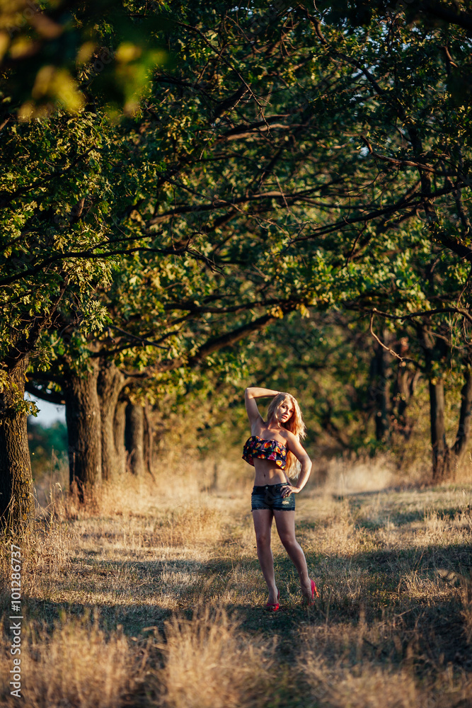 Fototapeta premium Portrait of blonde girl in the field