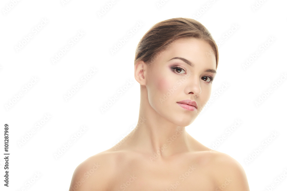 Closeup beauty portrait of calm young adorable brunette woman with trendy makeup posing with bare shoulders on white studio background Closeup beauty portrait of calm young adorable brunette woman with trendy makeup posing with bare shoulders on white studio background