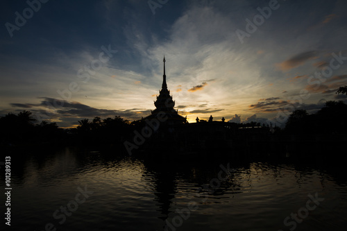 Silhouette of Thai temple during sunset with the elegance mood