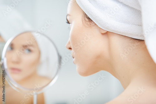 beautiful healthy woman and reflection in the mirror