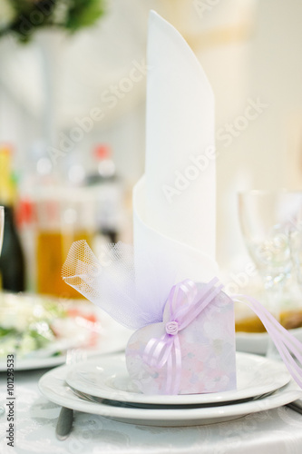 Banquet wedding invitation on table setting on evening reception