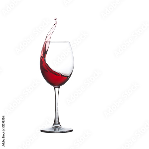 Red wine glass. Splashing alcohol drink, white background. copy space.