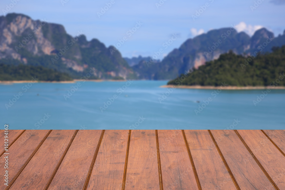 Empty wooden shelves with sea and mountain on background. For display product