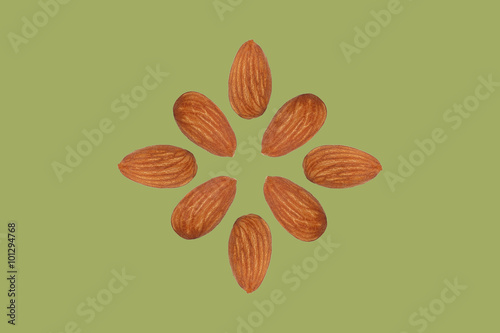 almond nut fruit organic healthy snack vegan green background