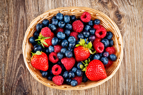 Berries on wooden background