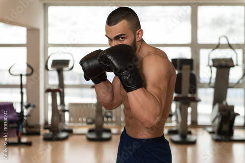 Young Athletic Man With Boxing Gloves © Jale Ibrak