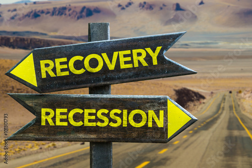 Recovery - Recession signpost in a desert background
