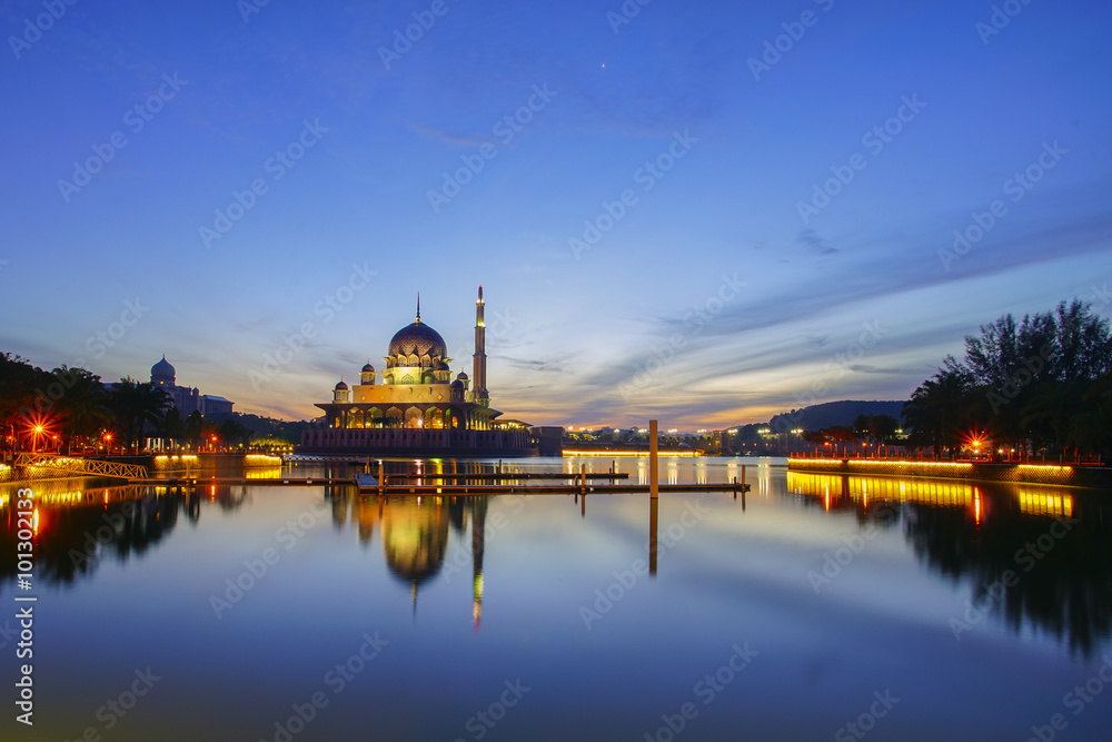 Beautiful reflection of Putra Mosque in the lake during blue hour