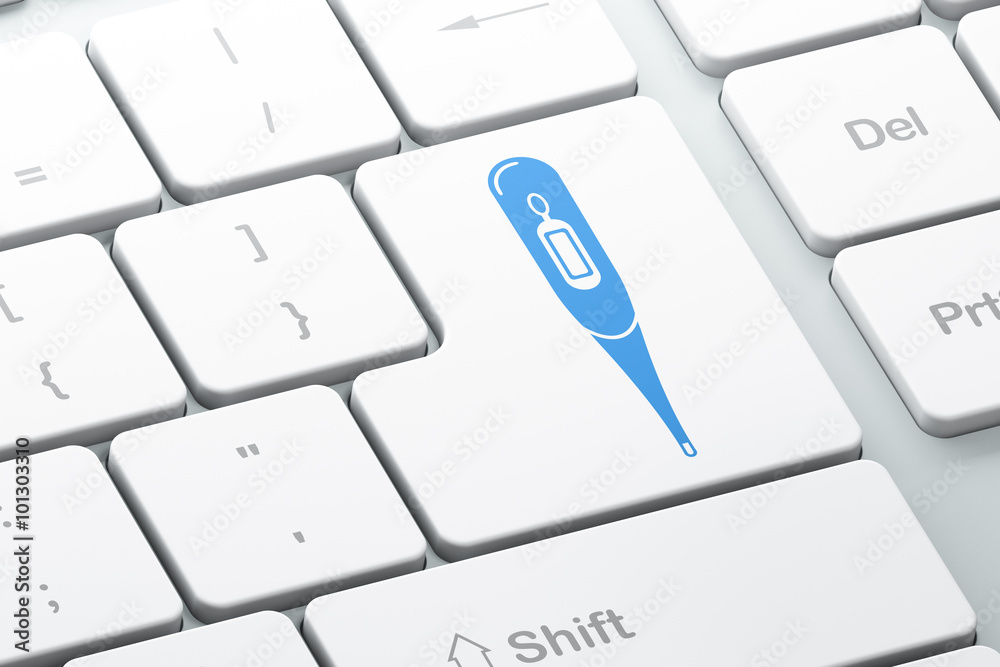Healthcare concept: Thermometer on computer keyboard background Healthcare concept: Thermometer on computer keyboard background