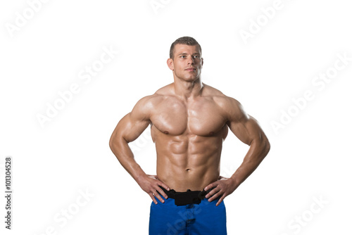 Muscular Bodybuilder Man Posing Over White Background © Jale Ibrak