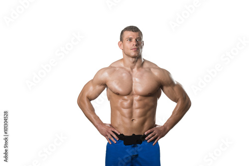 Muscular Bodybuilder Man Posing Over White Background