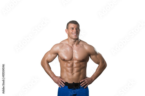 Muscular Bodybuilder Man Posing Over White Background