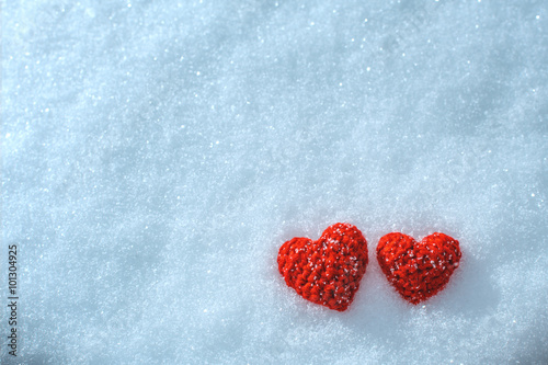 The knitting heart on a snowy background. Greeting card for Vale