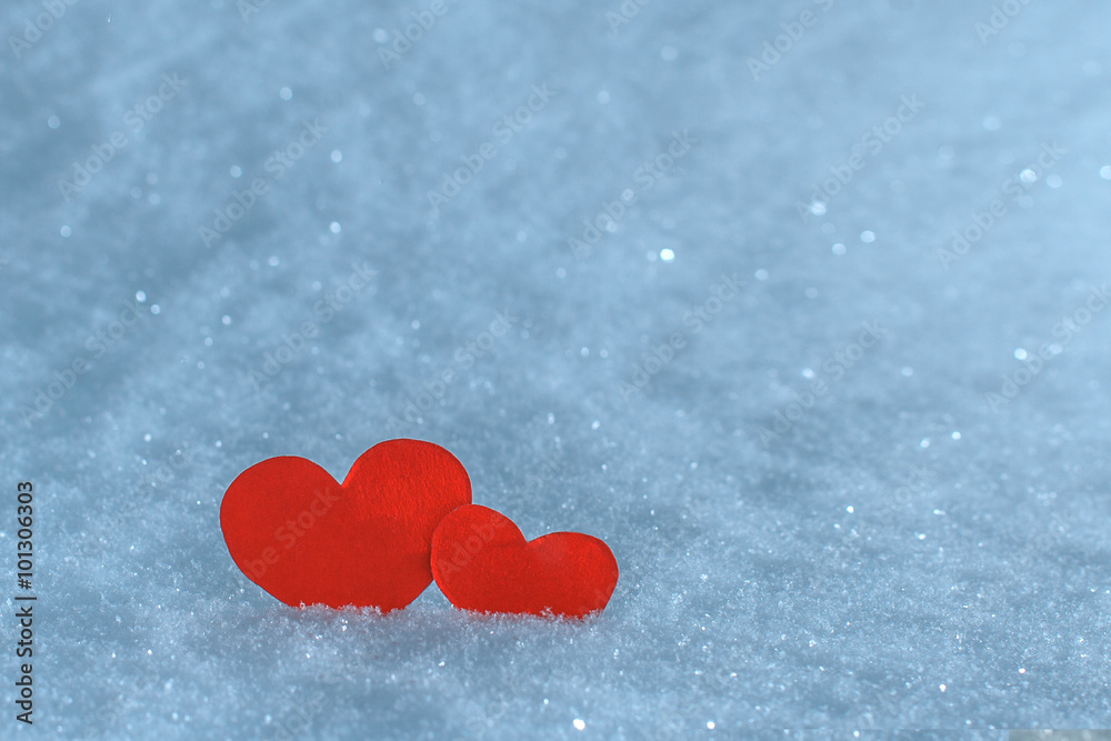 Red paper hearts in the snow. Greeting card for Valentine's Day. Red paper hearts in the snow. Greeting card for Valentine's Day.
