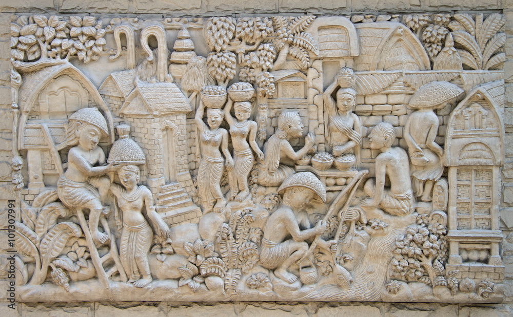 low relief representing life of ancient thai village