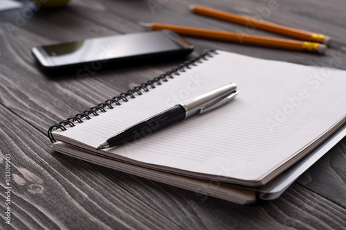 Closeup of a notebook with a pen