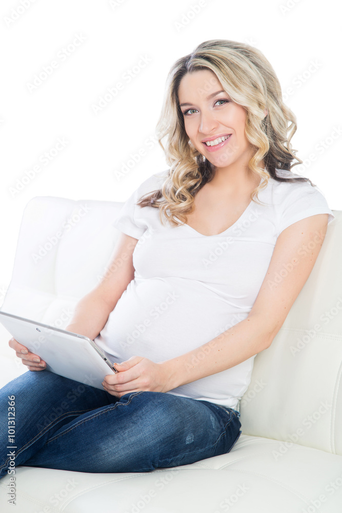 Young pregnant woman with a tablet Young pregnant woman with a tablet