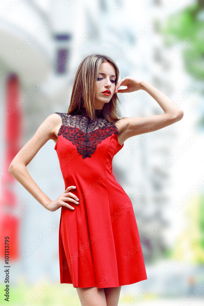 Beautiful young girl posing on city street Beautiful young girl posing on city street