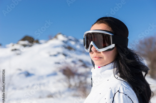 Woman Wearing Ski Goggles on Snow Covered Mountain