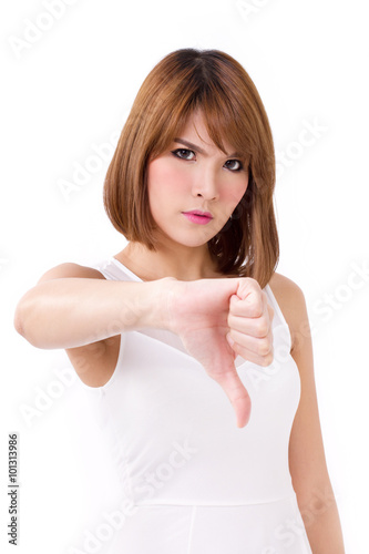 frustrated, upset, displeased woman giving thumb down gesture photo