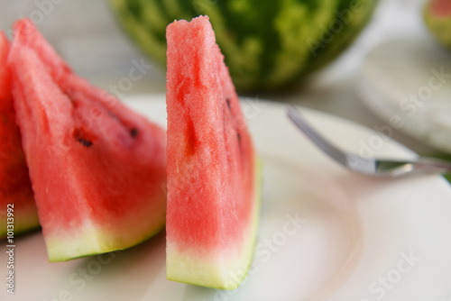 Sliced watermelon on plate closeup