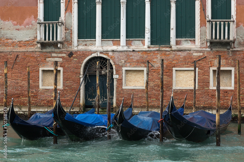 parked gondolas on a Venetian canal