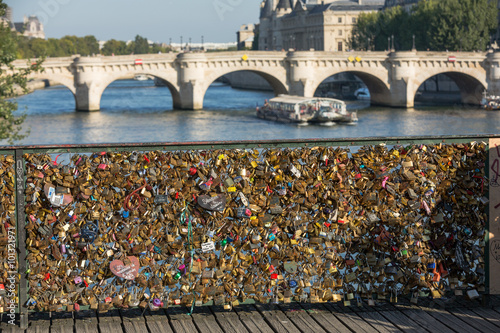 Paris, France - Pont   des Arts. Love padlocks on the bridge.   Passerelle des Arts is a pedestrian bridge in Paris which crosses the River Seine
