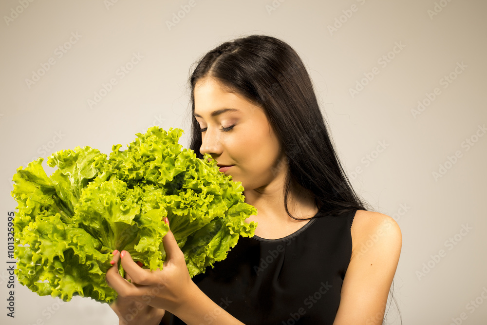 girl with vegetable salad on a light background girl with vegetable salad on a light background